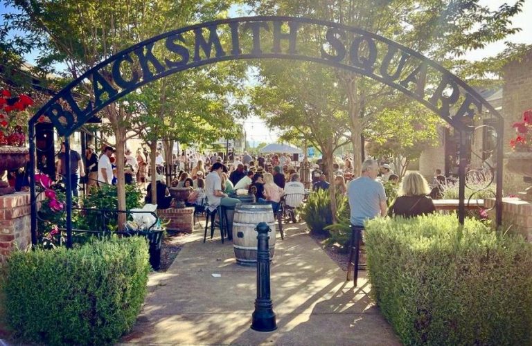 people hanging out at blacksmith square in livermore